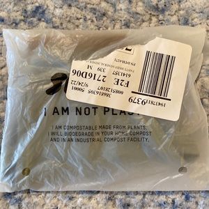 Skims tripped thong. New never opened